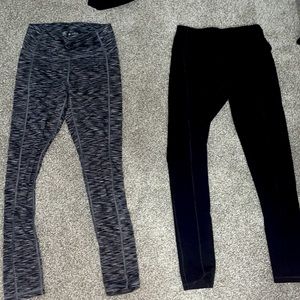 Two leggings with pockets! Never worn. Size small